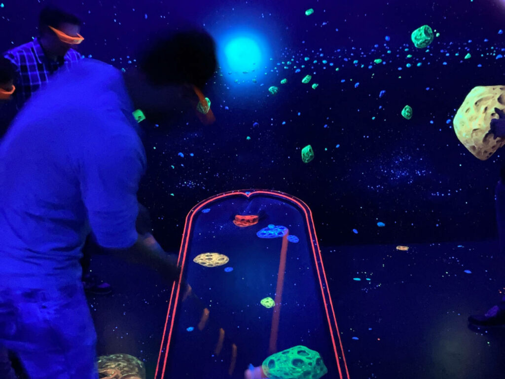 3D black light mini golf | shot on the track